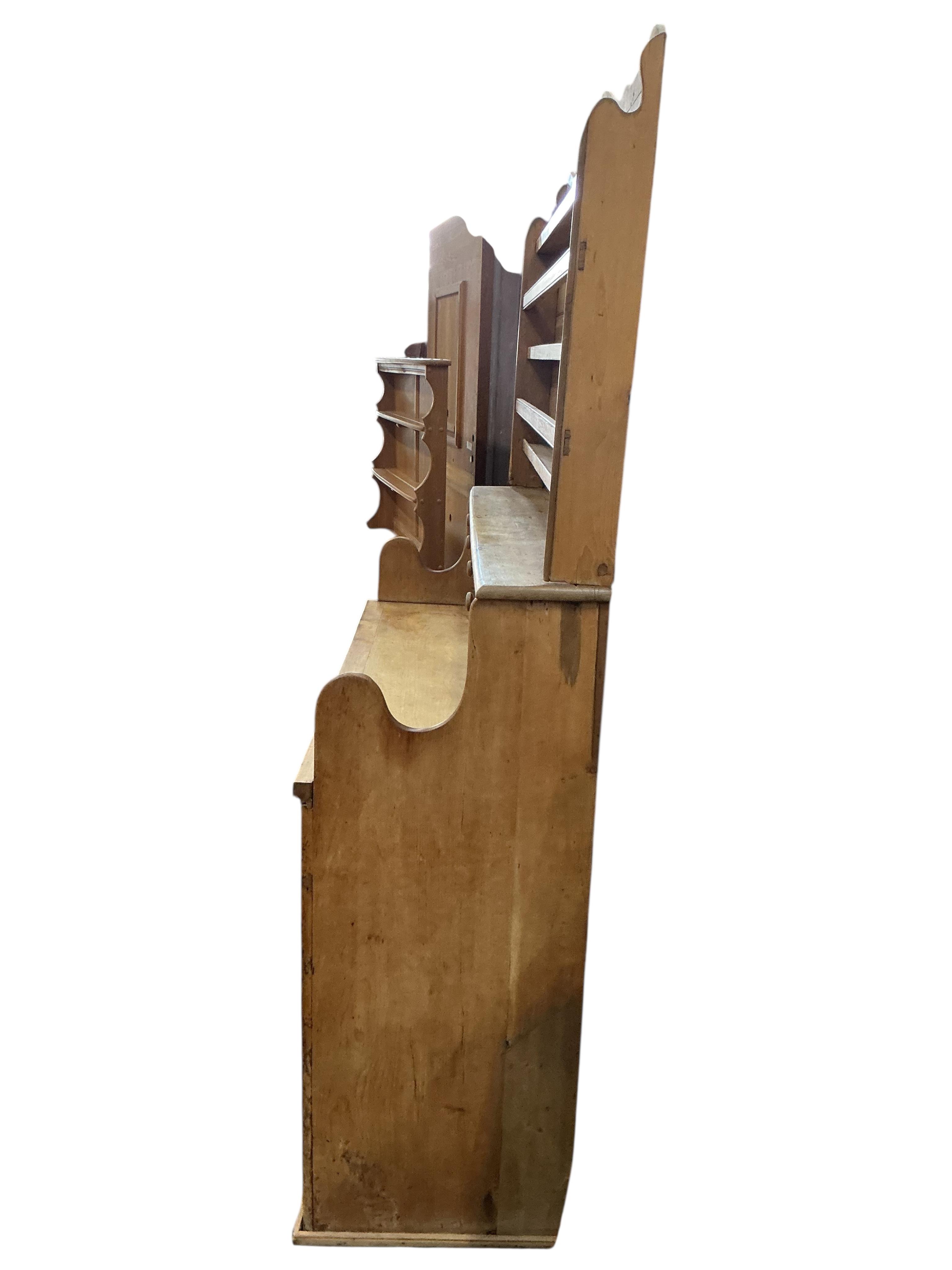 A 19th century Continental pine dresser, width 137cm, depth 50cm, height 210cm